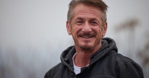 Actor Sean Penn hands over his award to Ukrainian President