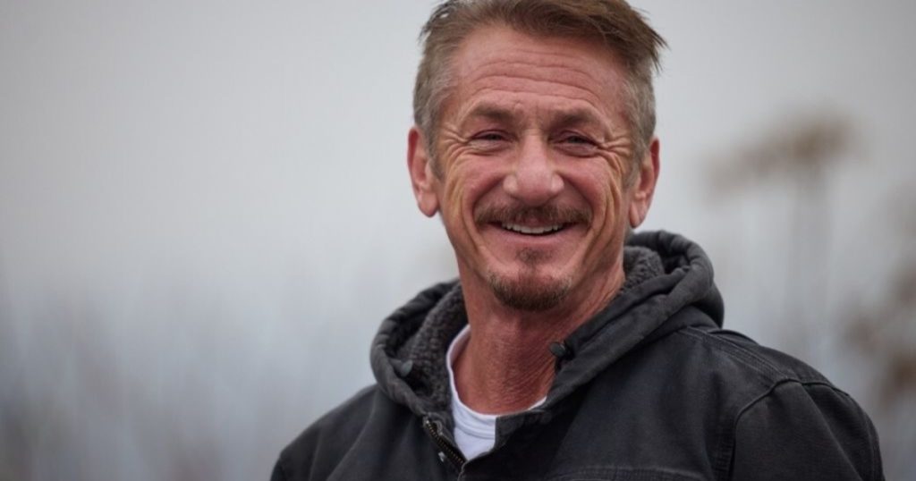 Actor Sean Penn hands over his award to Ukrainian President