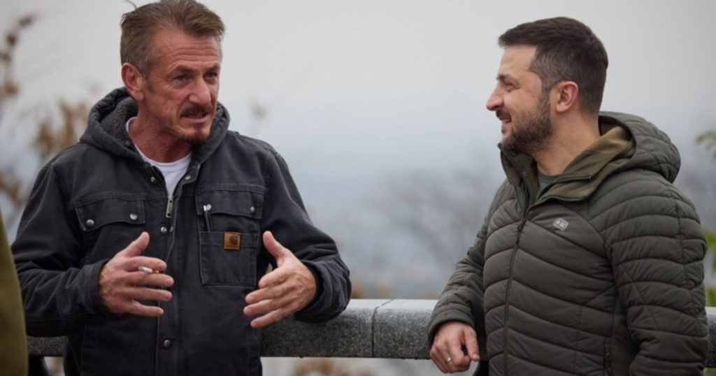 Actor Sean Penn hands over his award to Ukrainian President